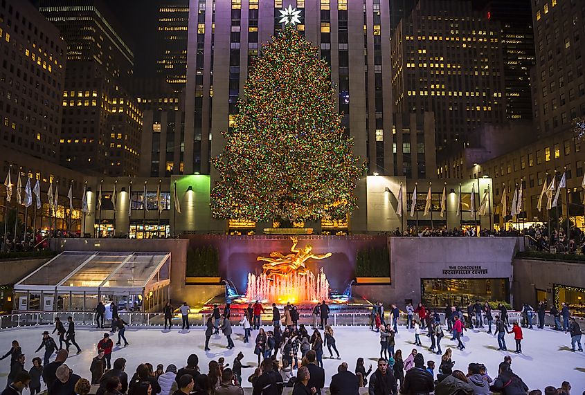 NEW YORK CITY - DECEMBER 10, 2015: Ice skaters fill the skating rink under the Rockefeller Center Christmas tree, a popular holiday tourist attraction in Midtown Manhattan.