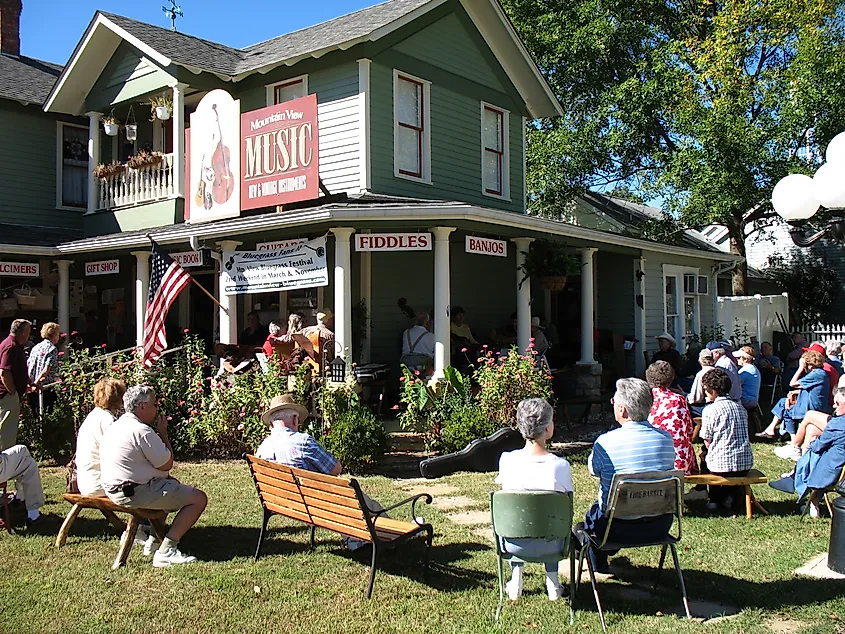 People enjoying a folk music performance in Mountain View, Arkansas.