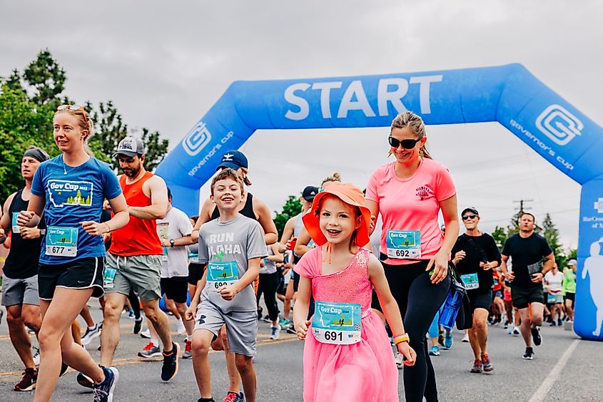 Helena, 2024: Little girl in pink dress at start line in Governor's Cup Marathon. Image Credit Cavan-Images via Shutterstock.