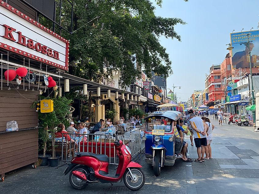 A matinee displays the name Khaosan, referring to the popular backpacking district that unfurls in the rest of the sunny picture. 