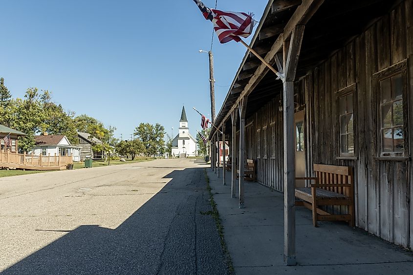 Main street at Bonanzaville USA museum in West Fargo, North Dakota, with a church along the boardwalk