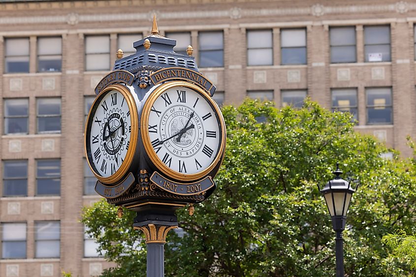 Afternoon light on historic clock and streetlight, downtown Alexandria, Louisiana.