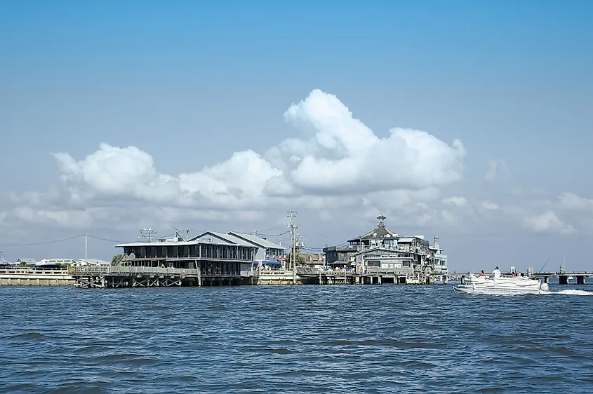The stilt-house waterfront at Cedar Key, Florida, seen from the Gulf channel