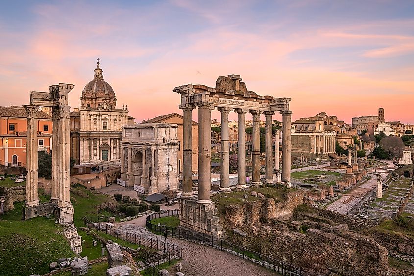 The historic Roman Forum ruins at dusk in Rome, Italy.