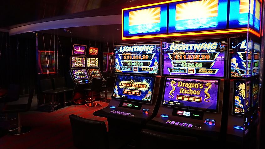 Interior of slot machines in gambling casino in Barcelona. Image Credit Solarisys via Shutterstock.