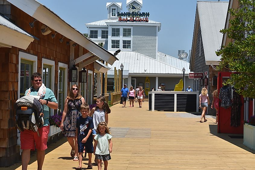 A family explores the grounds of Barefoot Landing in North Myrtle Beach, South Carolina.