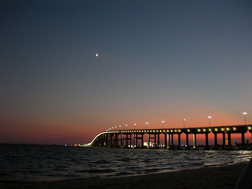 A bridge across the sea in Ocean Springs, Mississippi, at night.