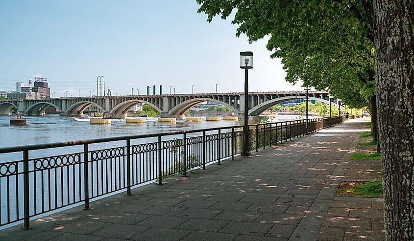 Walking path in the St. Anthony Falls historic distric in downtown Minneapolis, known as the Grand Rounds Scenic Byway, next to the Mississippi River