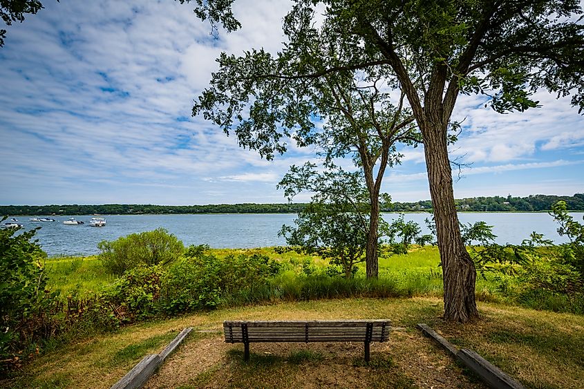 A bench overlooking Town Cove in Orleans, Cape Cod, Massachusetts, with a serene water view.