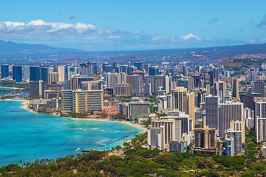 Skyline of Honolulu city as seen from Diamond Head State Monument lookout, with Waikiki beach landscape and ocean views.