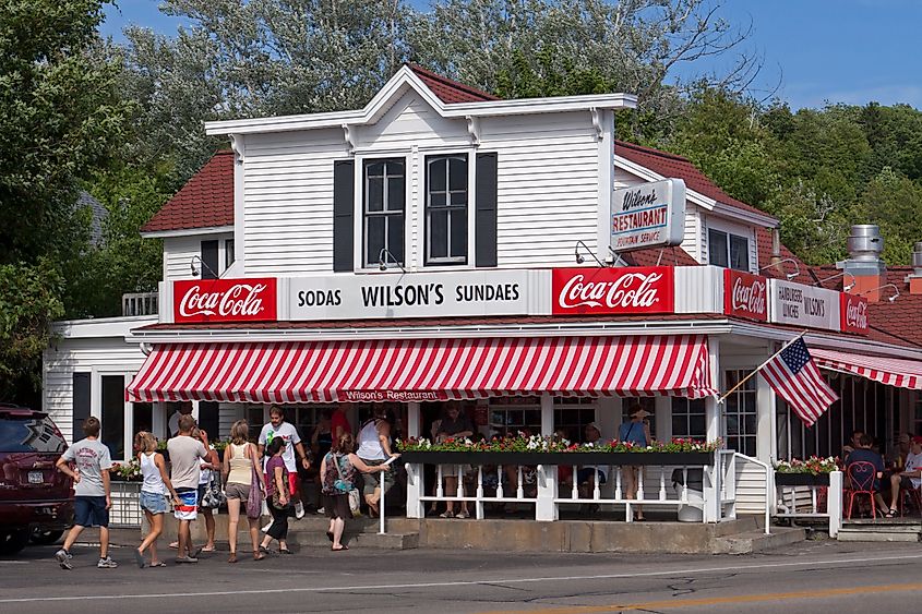 A group of tourists enter Wilson's Restaurant & Ice Cream Parlor in Door County, Wisconsin on a hot summer day.