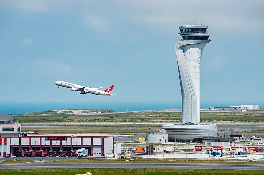  Turkish Airlines airplane with Air Traffic Control Tower of Istanbul Airport.