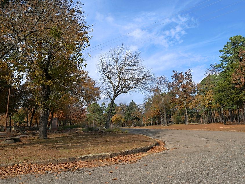 Brilliant autumn colors at Robbers Cave in Wilburton, Oklahoma, set against a backdrop of clear blue skies.