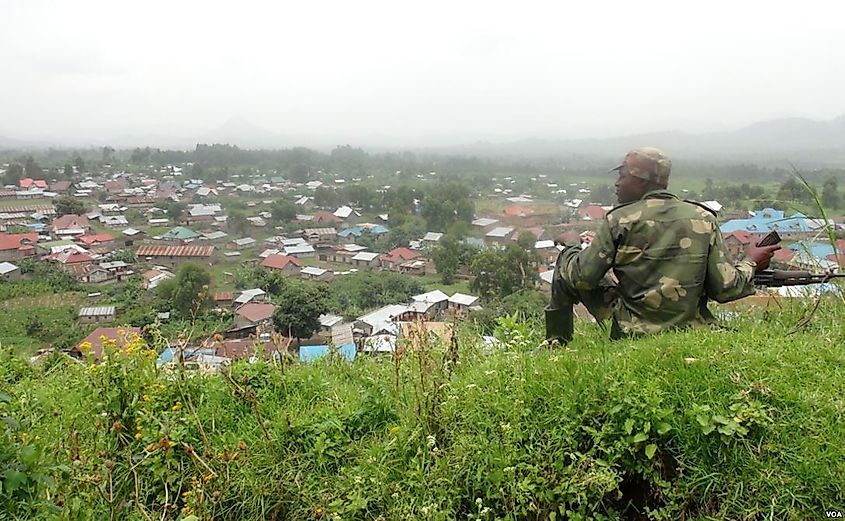 An M23 Rebel outside of Bunagana. Image Credit Nicolas Pinault via Wikimedia Commons.