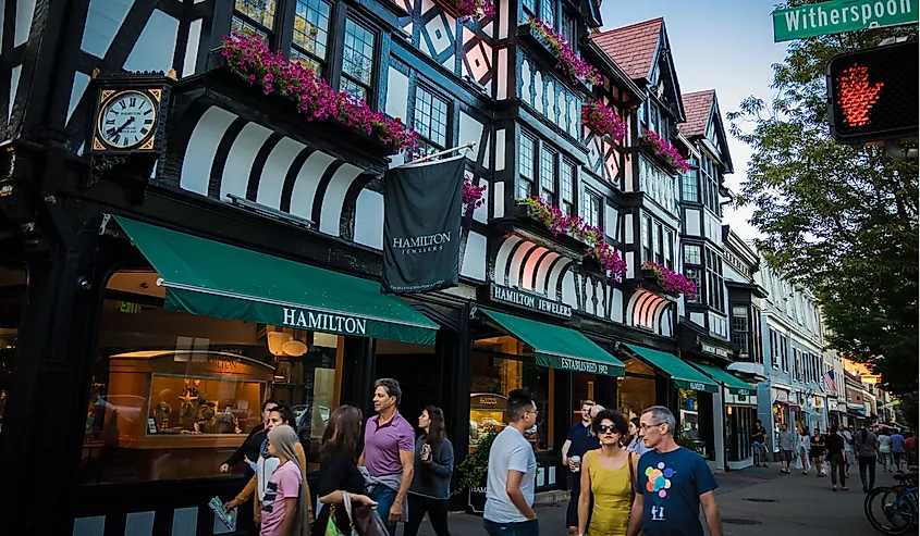 Shoppers and pedestrians near Tudor-style building on Witherspoon Street in Princeton, New Jersey.