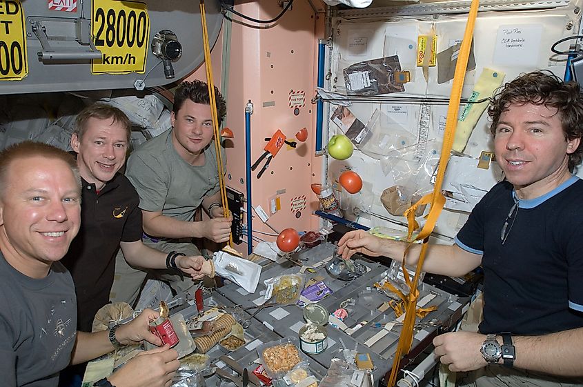 Astronauts sharing a meal on board of the International Space Station