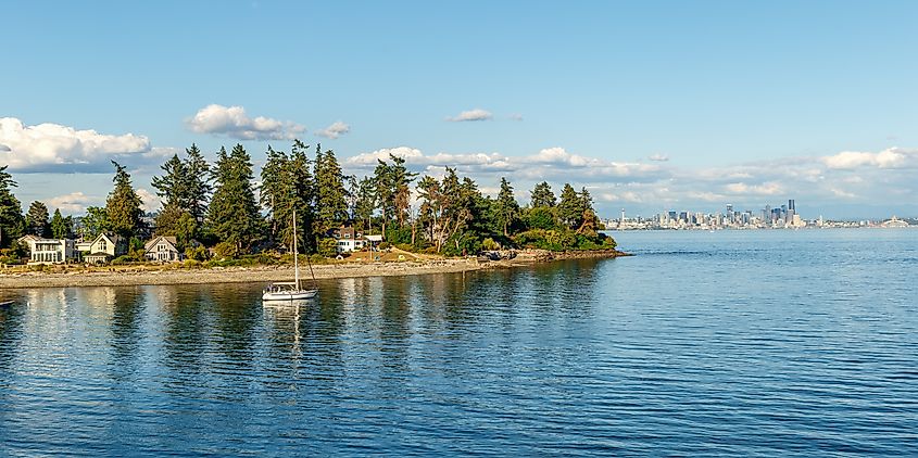 Secluded residences on Bainbridge Island with skyline of Seattle in the background