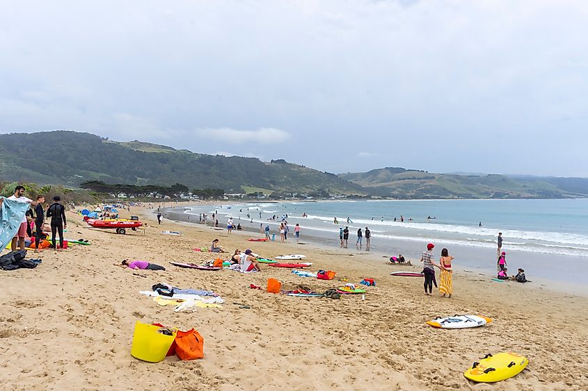 People relaxing along the beach in the town of Apollo Bay, Victoria