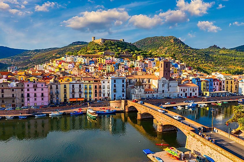 Aerial view of the beautiful village of Bosa with colored houses and a medieval castle.