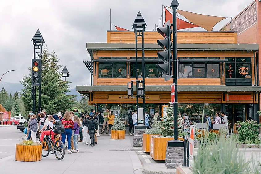 Banff, Alberta, Canada - July 09 2024 : Downtown, walking street with caffee, restaurants and suvenir shops