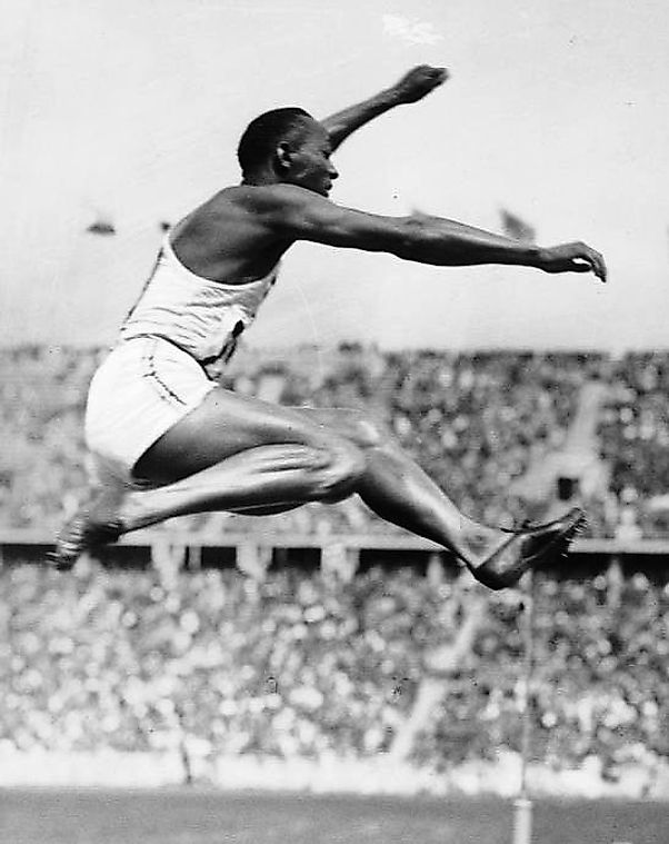 Owens competing in the long jump at the 1936 Summer Olympics in Berlin