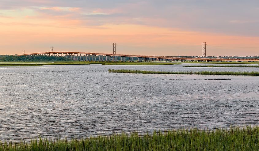 View of Bogue Sound and Emerald isle bridge from the dock at Emerald Isle Woods Park at sunset. North Carolina