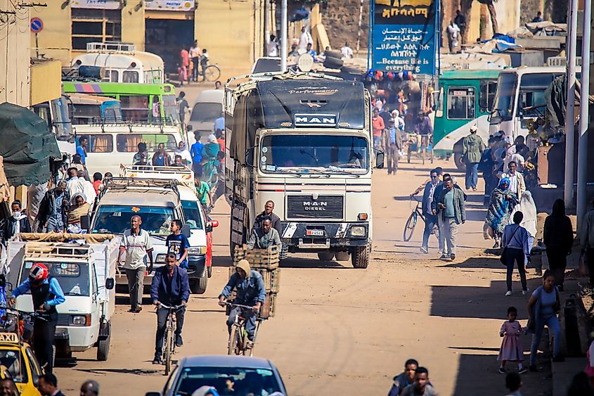 Yellow taxi and other cars on a central street in Asmara, Eritrea. Image Credit Dave Primov via Shutterstock.