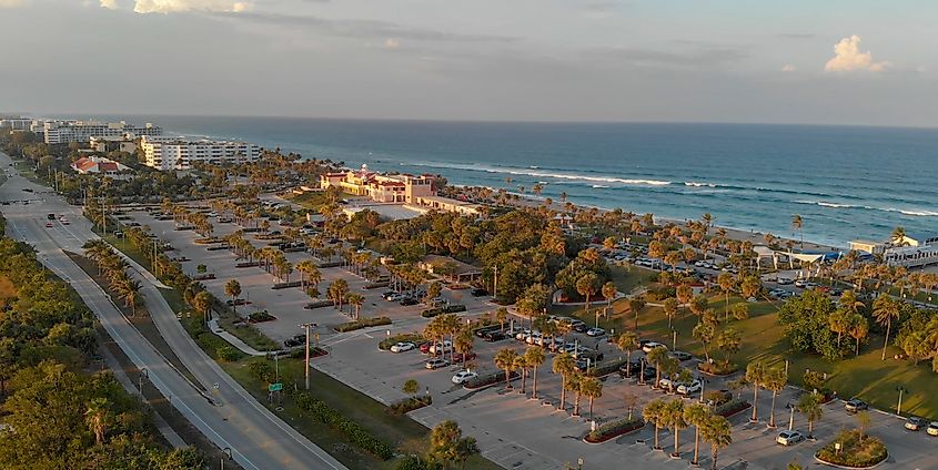 Aerial panorama of Lake Worth's coastline in Florida during an amazing sunset, with vibrant colors reflecting over the water and shoreline.