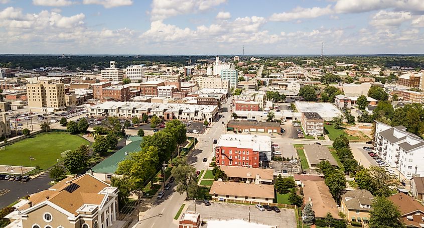 The downtown city skyline and buidlings of Sprigfield MO, under partly cloudy skies aerial perspective.