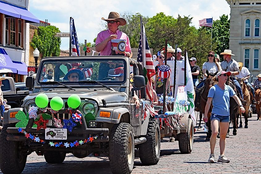 The 87th annual Flint hills rodeo parade rides through the town of Cottonwood Falls.
