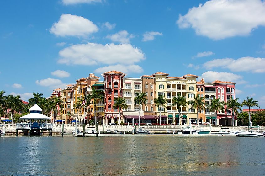Colorful Spanish influenced buildings overlooking the water in tropical Naples, Florida