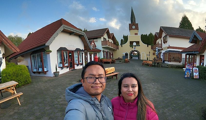 Couple enjoying in Swiss Village, Grindelwald, Tasmania, Australia