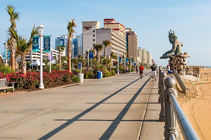 The oceanfront boardwalk and resort area along the Atlantic coast, which features a 34-foot tall statue of King Neptune, via Sherry V Smith / Shutterstock.com