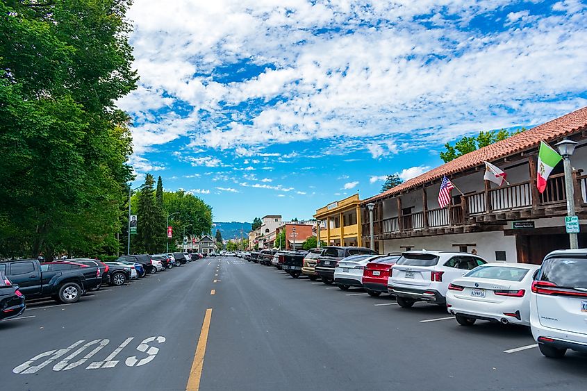 Cars parked by Sonoma Plaza in downtown Sonoma flanked by historical buildings and shaded by trees. Editorial credit: Michael Vi / Shutterstock.com