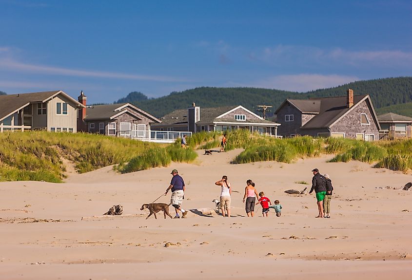 People walk with their pets in Manzanita, Oregon.