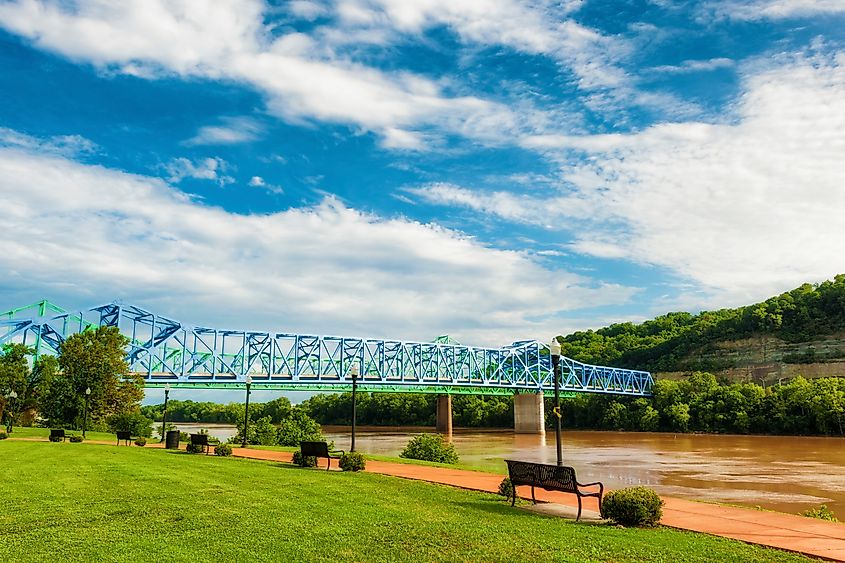 The Ohio River flows under two bridges along a waterfront park in Ashland, Kentucky