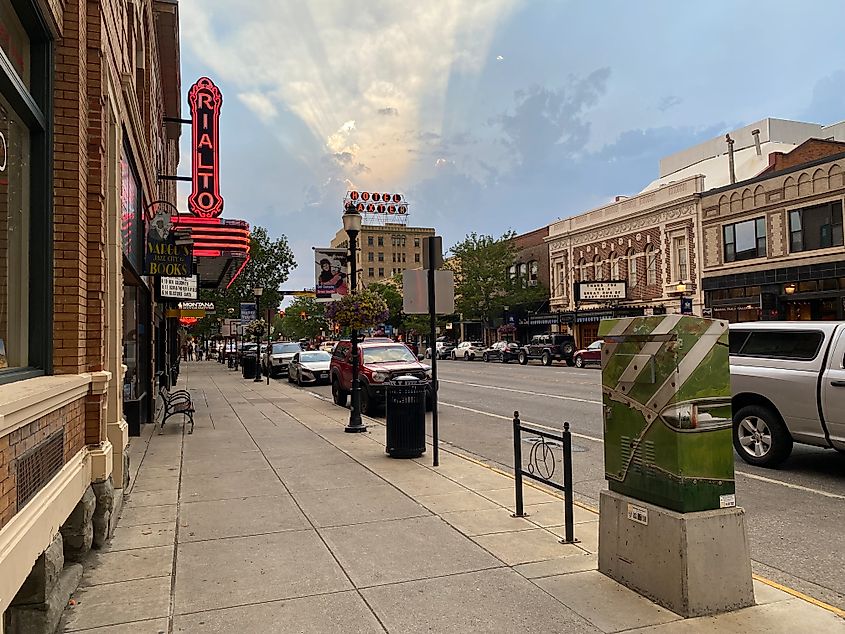 Sunlight radiates from behind the historic Baxter Hotel, as seen in the distance in downtown Bozeman, Montana.