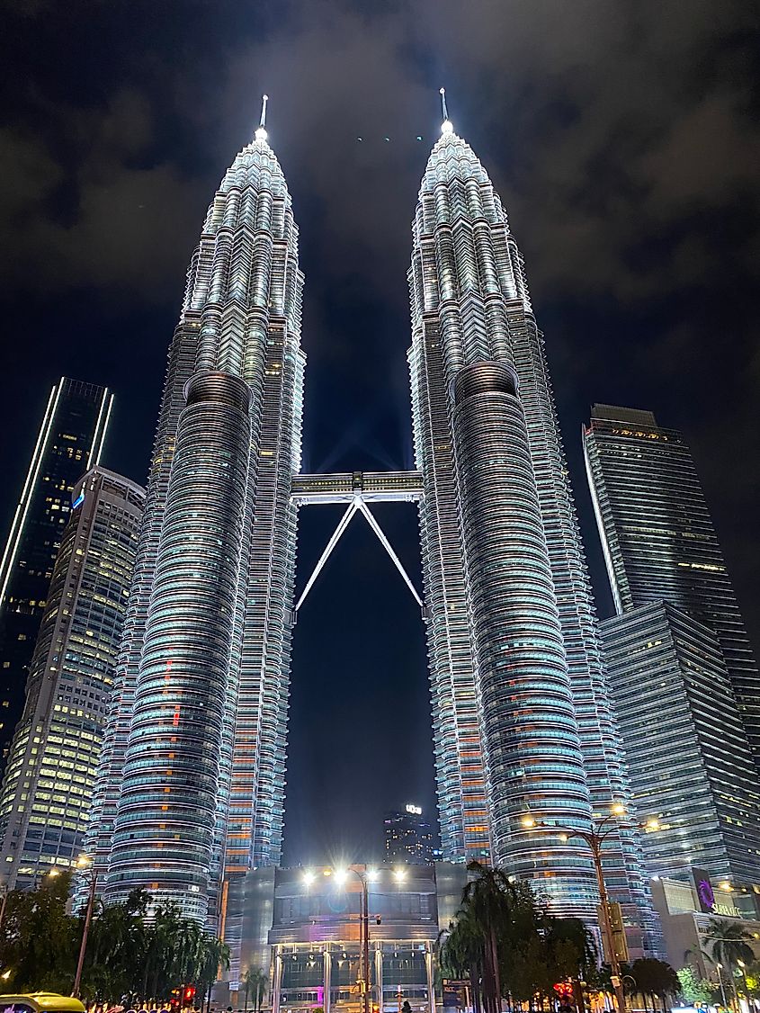 Kuala Lumpur's spectacular Petronas Twin Towers illuminated at night.