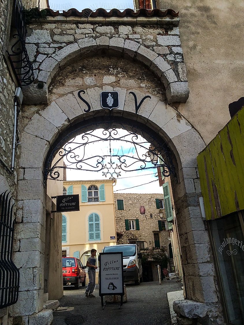 Saint-Vallier-de-Thiey, France - arched stone entryway to shops. Editorial credit: Mike Seberger / Shutterstock.com