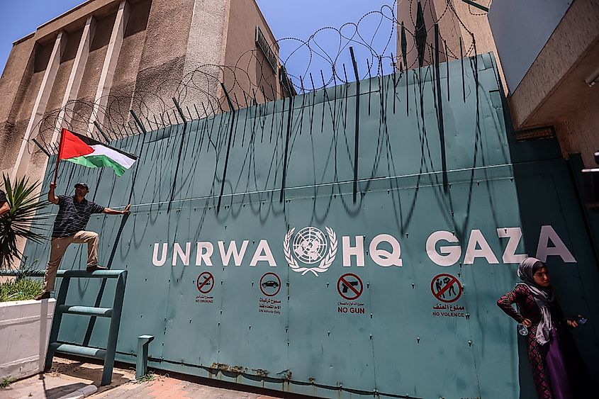 Palestinian refugees gather with national flags outside the United Nations Relief and Works Agency (UNRWA) in Gaza City.