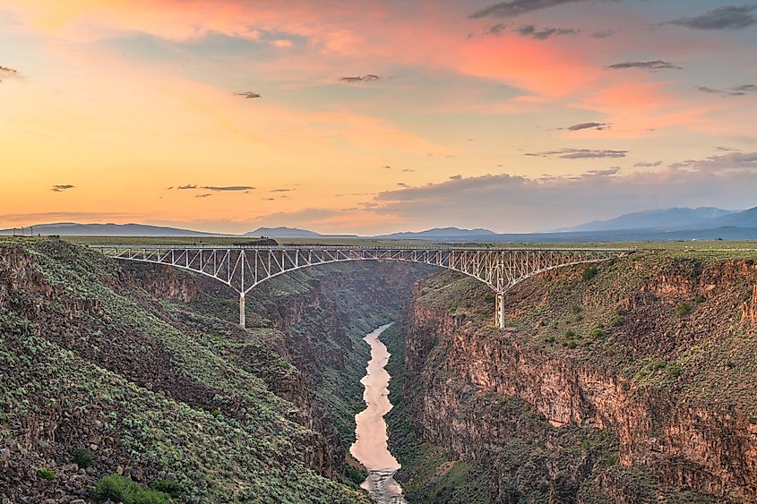 Taos, New Mexico, USA at Rio Grande Gorge Bridge over the Rio Grande at dusk.