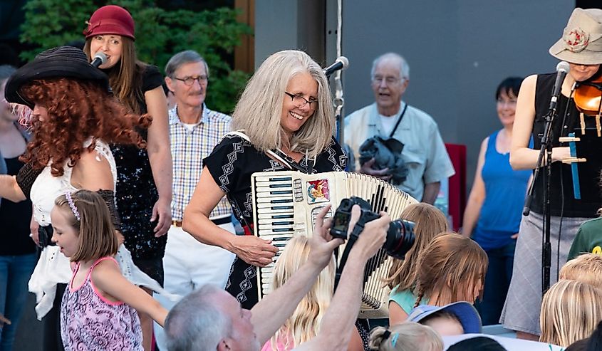 Stephany Smith Pearson of the Bathtub Gin Serenaders performs for the free, outdoor "Green Show," held six nights a week at the Oregon Shakespeare Festival.