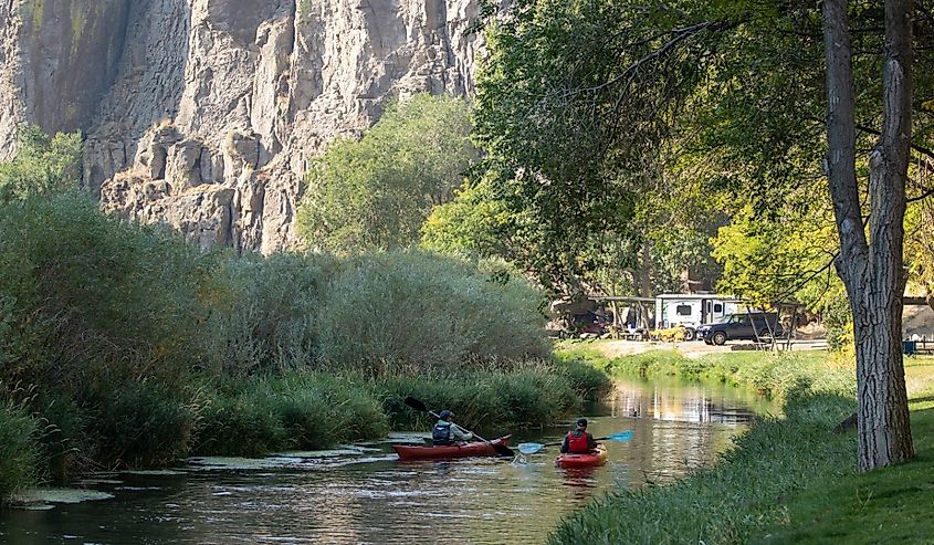 Kayakers in Salmon Falls Creek at Balanced Rock Park, Buhl, Idaho.