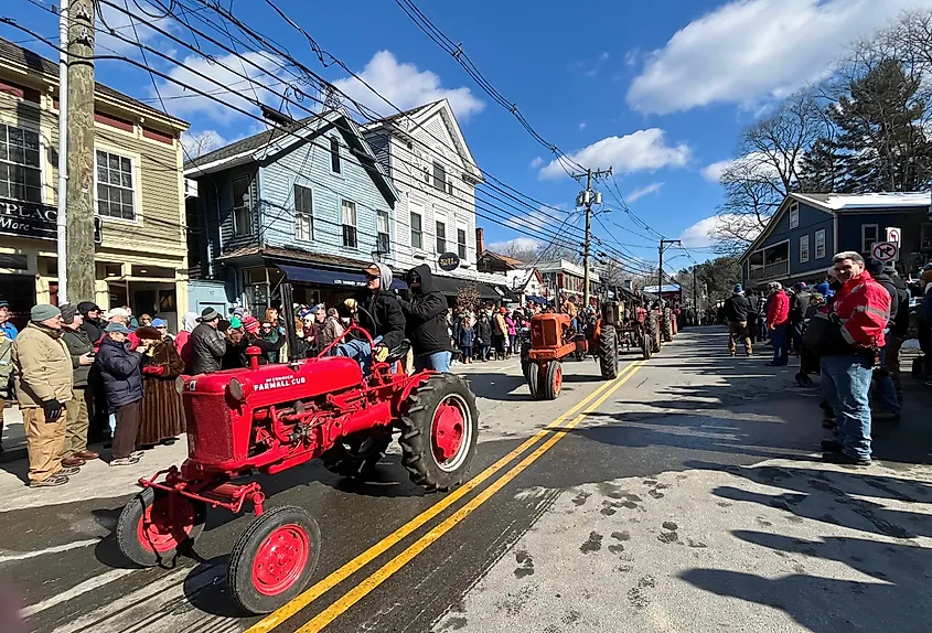 Tractors pass through the small New England town of Chester, Connecticut during a tractor parade.