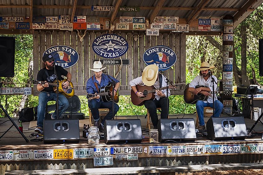Country music band playing in a music venue in Luckenback, Texas, via TLF Images / Shutterstock.com