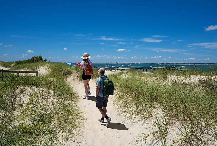 A couple hiking on a beach near Beaufort, South Carolina.