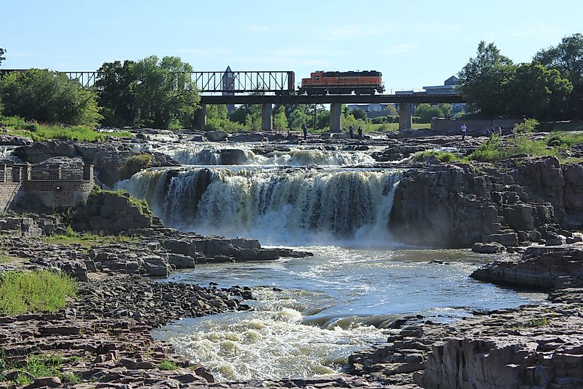 A train crosses Falls Park in Sioux Falls, South Dakota.