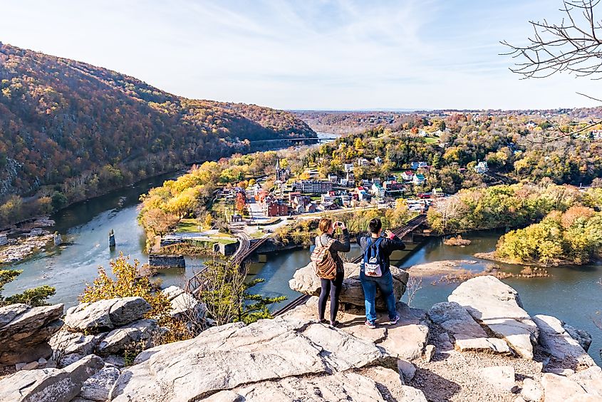 Overlook in Harpers Ferry, West Virginia, with a couple of hikers enjoying the colorful orange and yellow foliage