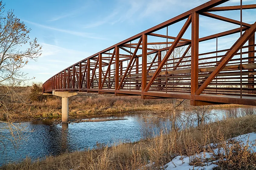 Bike trail and a footbridge over the South Platte River near Brighton, Colorado.