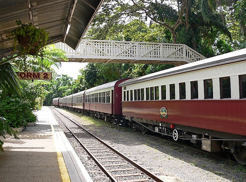 The Kuranda Scenic Railway train stopped at a station platform in Kuranda, Queensland, Australia.